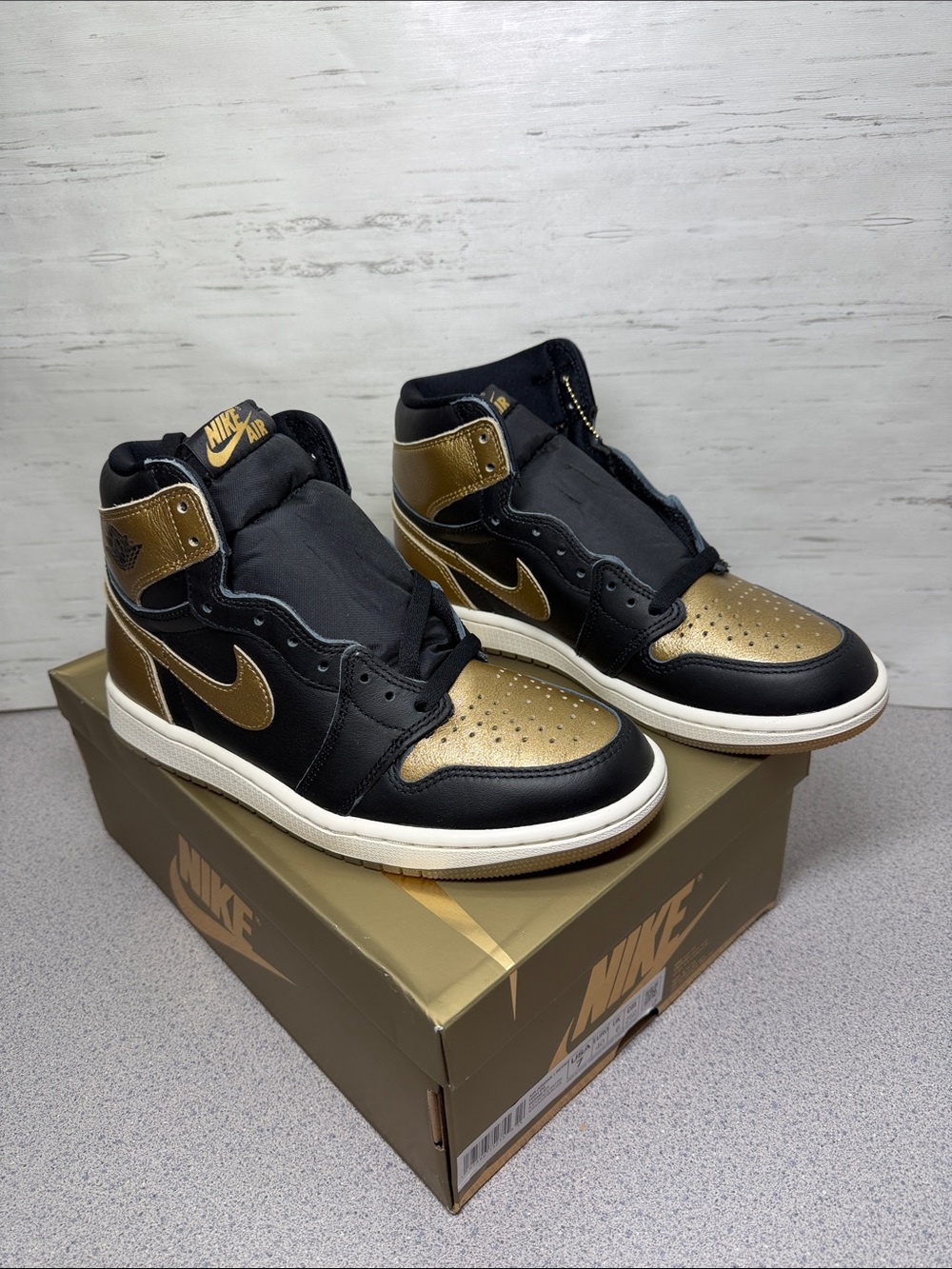 Jordan High-Top Sneakers in Black and Metallic Gold